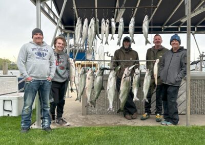 Charter fishing group photo with salmon and lake trout