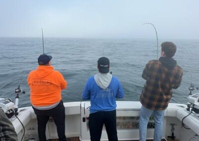 Fishing on back of charter fishing boat