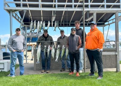 Charter fishing group photo with salmon and lake trout