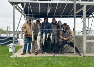 Charter fishing group photo with salmon and lake trout