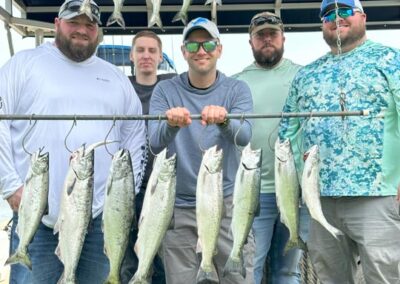 Charter fishing group photo with salmon and lake trout