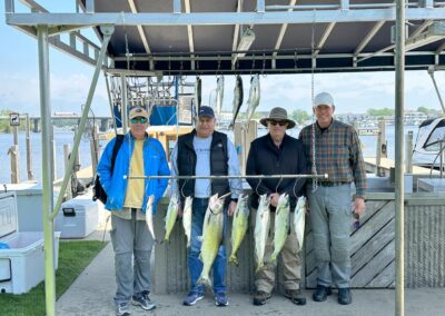 Charter fishing group photo with salmon and lake trout