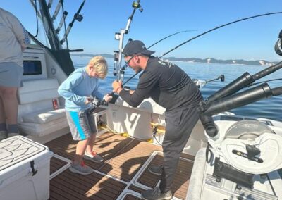 Fishing on back of charter fishing boat