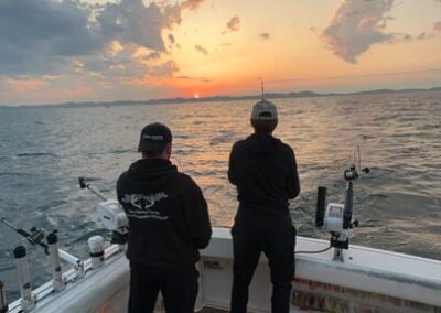 Fishing on back of charter fishing boat