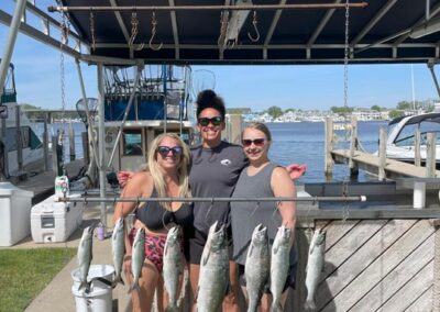 Charter fishing group photo with salmon and lake trout