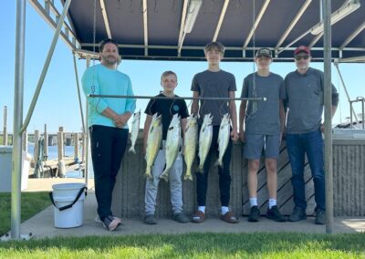 Charter fishing group photo with salmon and lake trout