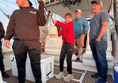 Fishing on back of charter fishing boat