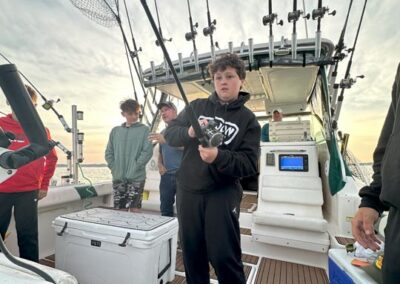 Fishing on back of charter fishing boat