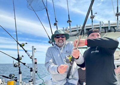 Fishing on back of charter fishing boat