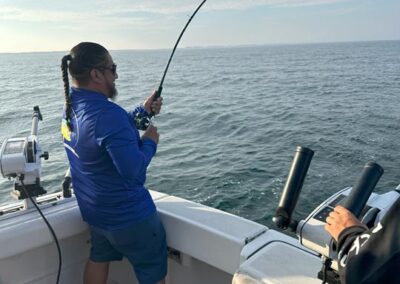 Fishing on back of charter fishing boat