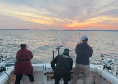 Fishing on back of charter fishing boat