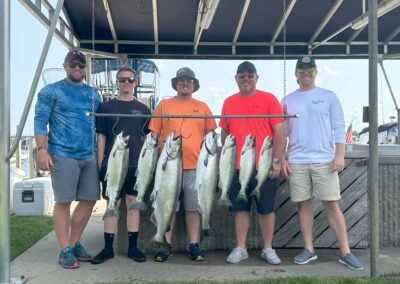 Charter fishing group photo with salmon and lake trout