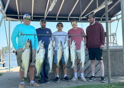 Charter fishing group photo with salmon and lake trout