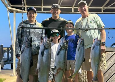 Charter fishing group photo with salmon and lake trout